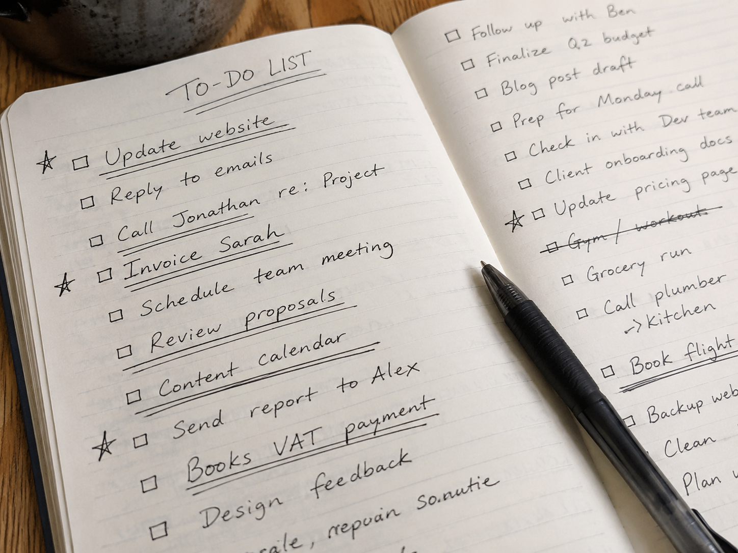 Overflowing handwritten to-do list with multiple items underlined and starred